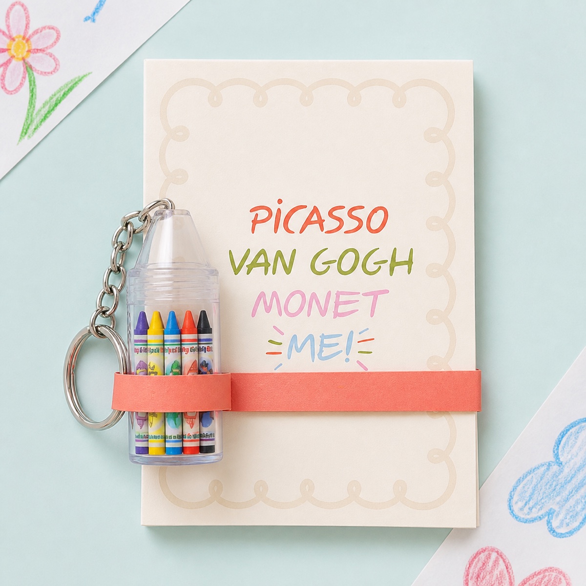 A drawing pad and colorful art supplies styled as a party favor