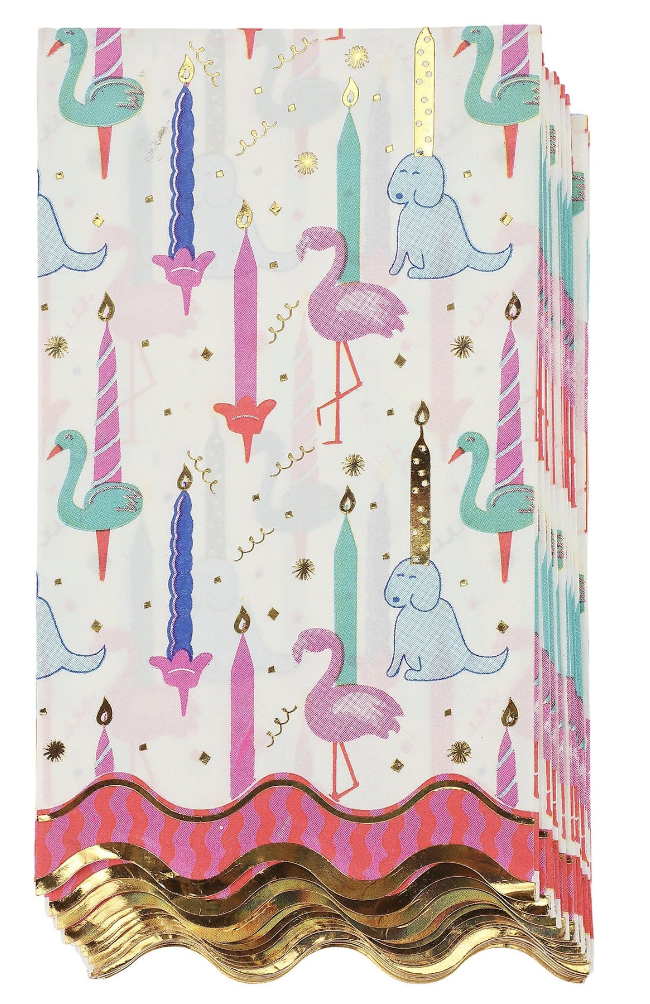 Whimsical party napkins with colorful candles, swans, and celebratory details